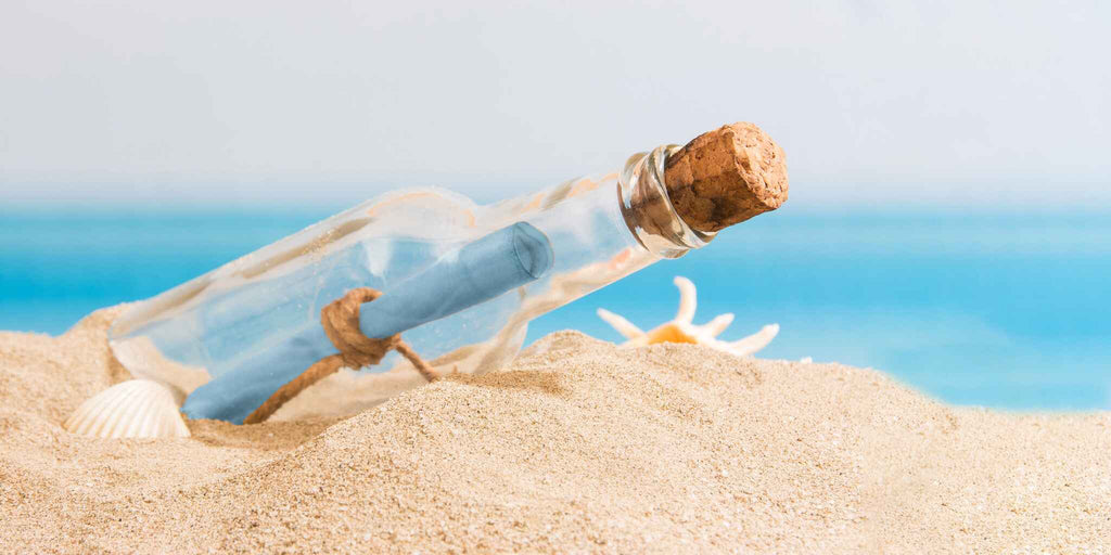 Message in a bottle on beach 