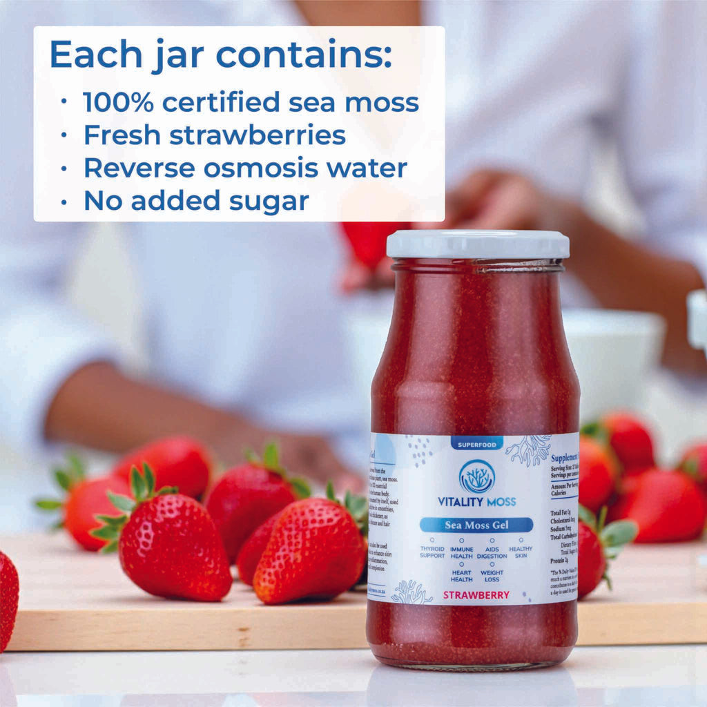 Jar of strawberry sea moss gel with ingredients listed with a kitchen background