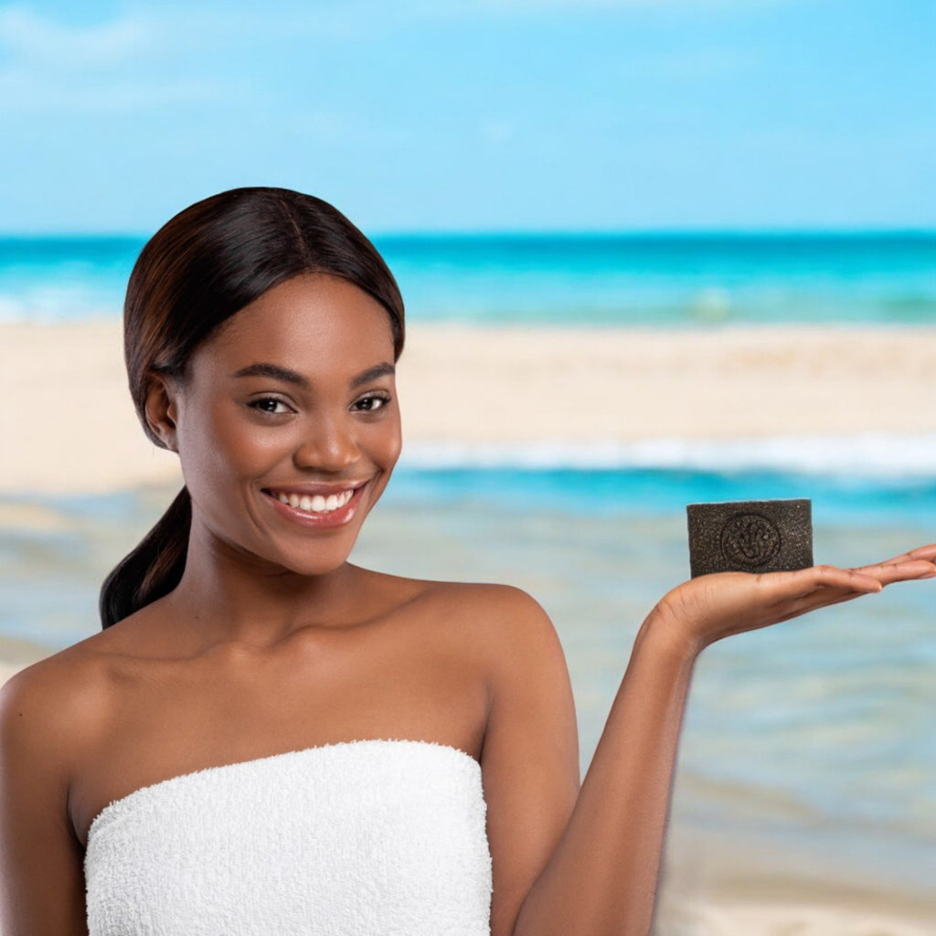 Woman holding sea moss soap on the beach 